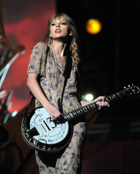 Taylor Swift playing the ukelele during the 54th Grammy Awards